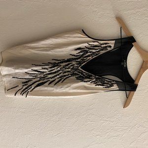 Sheer black/white top with sequence detail.